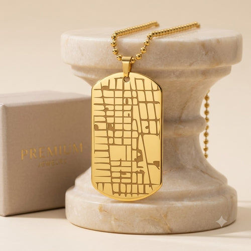 Front side of custom location map dog tag necklace in polished stainless steel.
