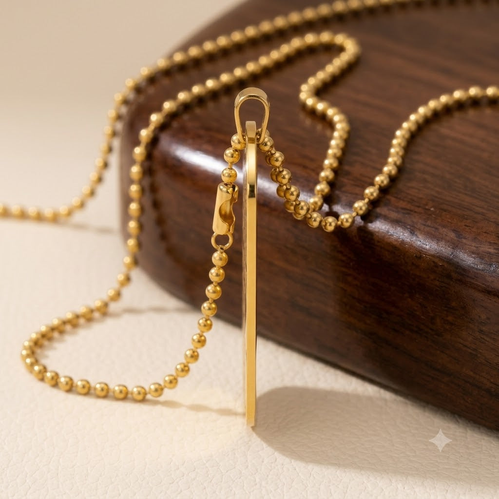 Size chart graphic showing 1.1 inch by 2 inch pendant dimensions and 24 inch chain.
