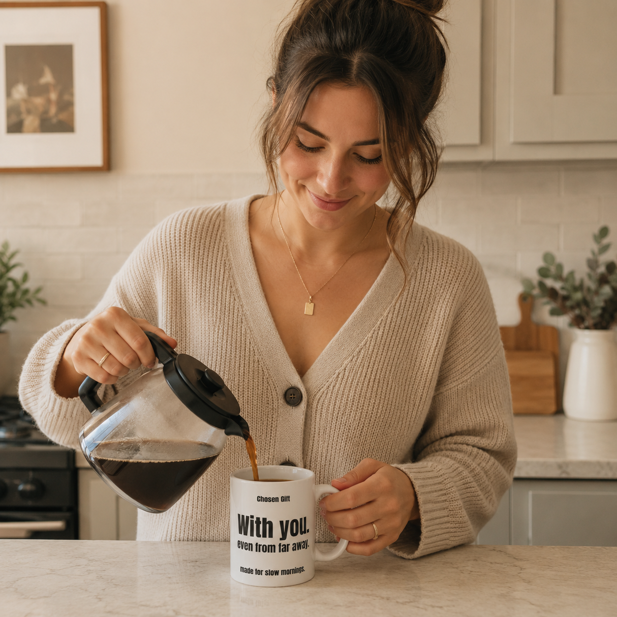 Woman pouring coffee into a personalized long distance mug in a kitchen